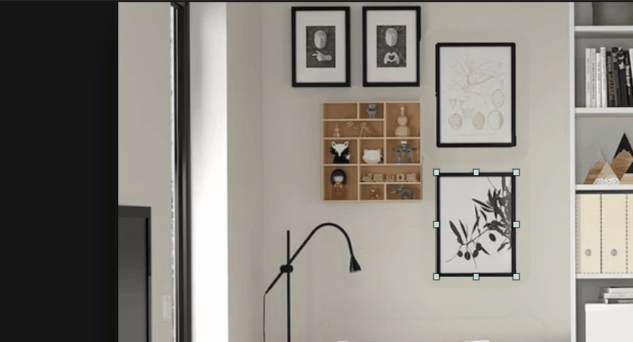 A framed olive print selected on a gallery wall, with the box handles ready to move it.